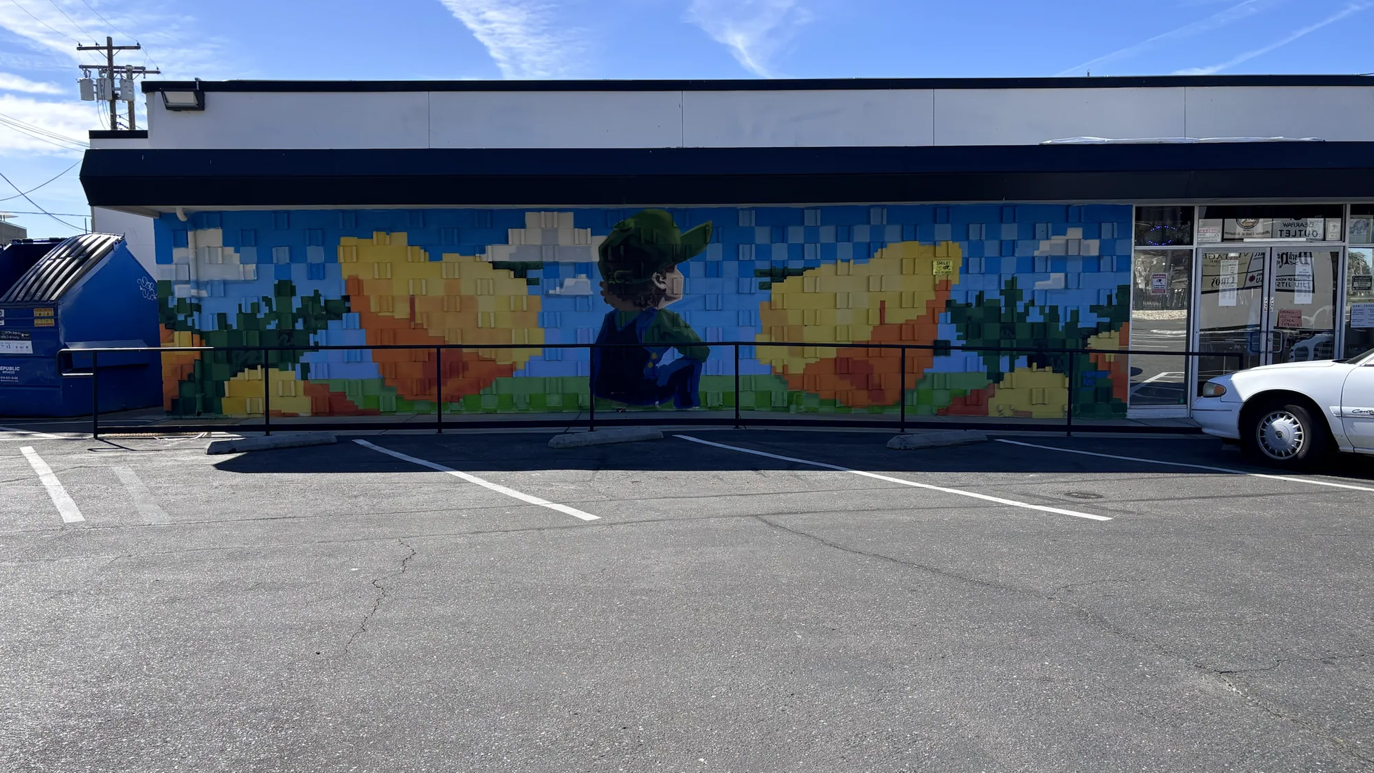 MAMMXTH exterior mural with landscape and figure